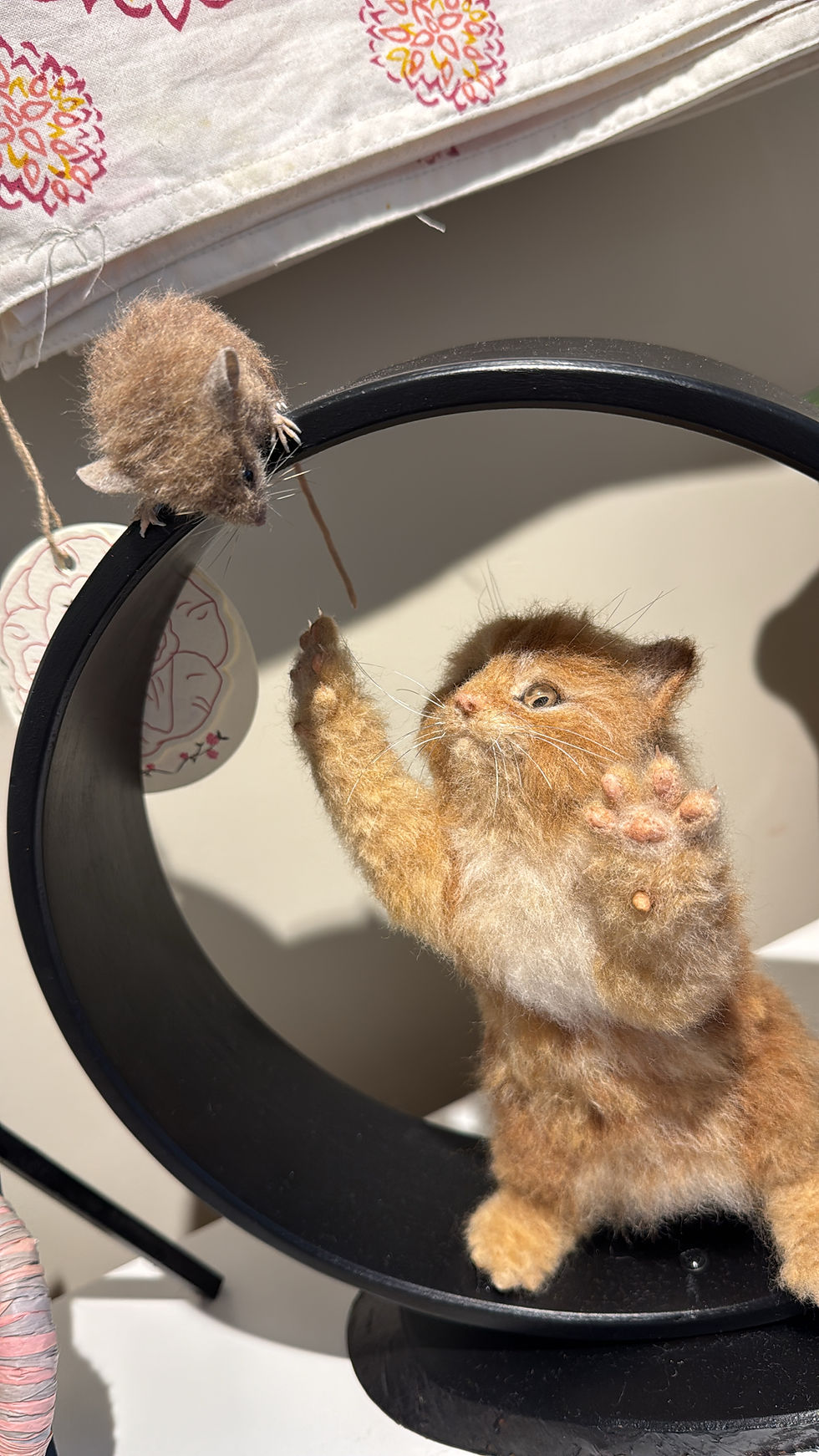 Thumbnail: felted cat and mouse within a black circle sculpture