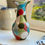 Thumbnail: multi coloured stoneware vase in hour glass shape
