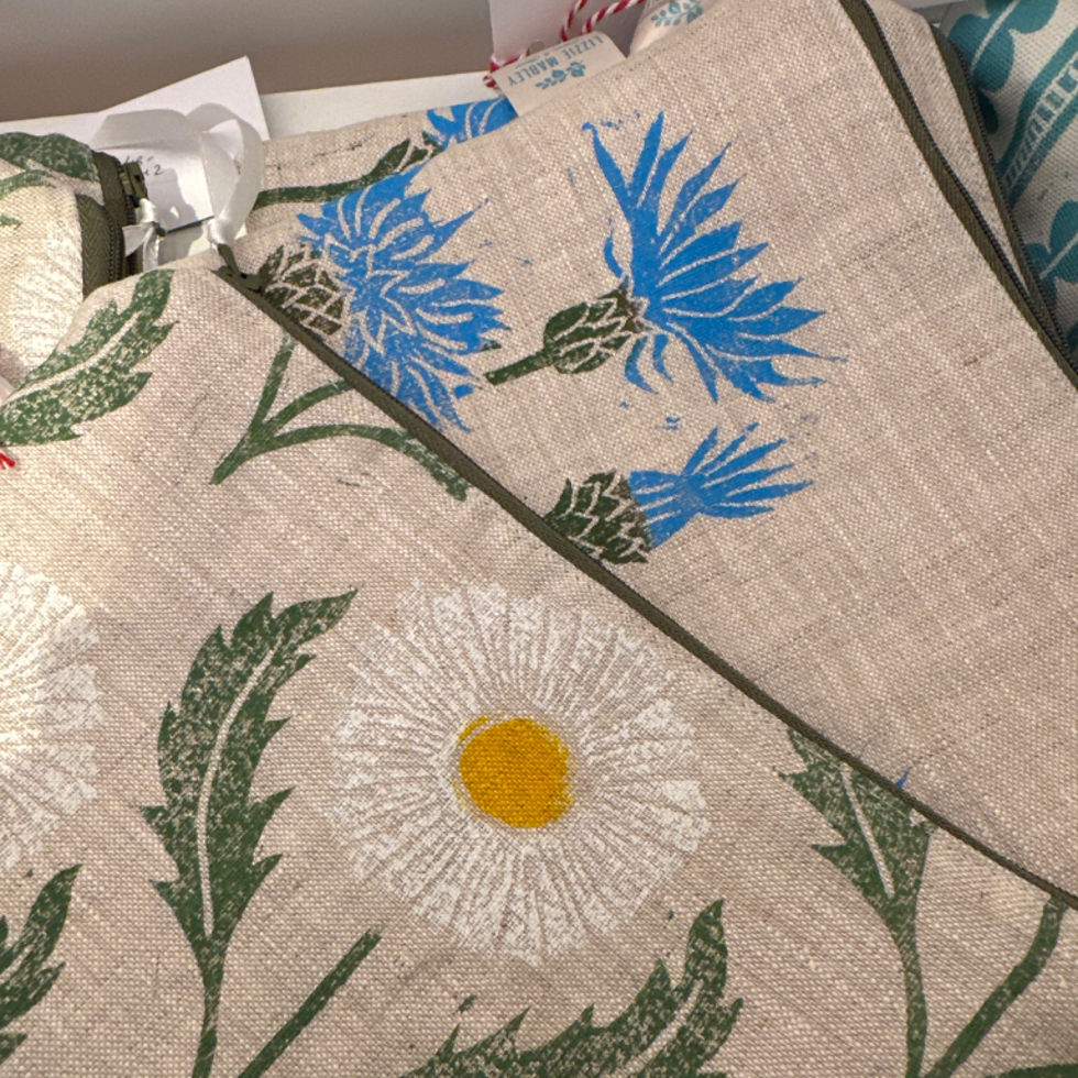 Thumbnail: white flower and blue flower on fabric