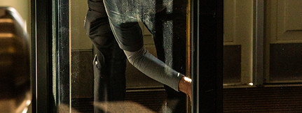 A person looks out a glass door._edited.jpg