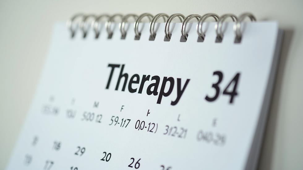 Close-up view of a calendar with therapy appointments marked