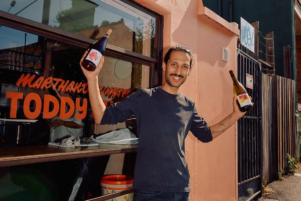 man with wine bottles in his hands