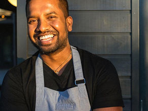 man in apron smiling
