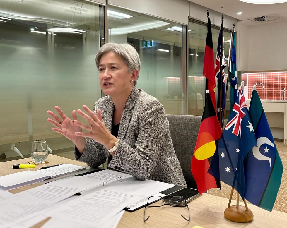 woman sitting on desk with flags