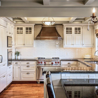 Occupied home staging kitchen in River Ridge, Springbank featuring custom cabinetry, luxury finishes, and timeless design.