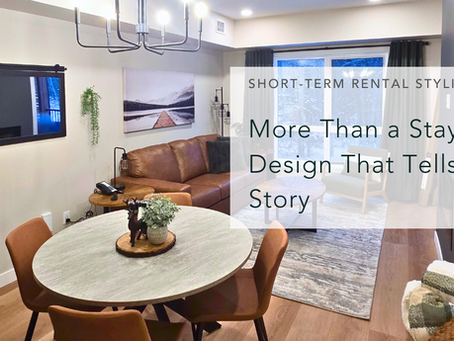 Modern living room with brown sofa, round table, and decor. Text reads "More Than a Stay—Design That Tells a Story." Cozy vibe