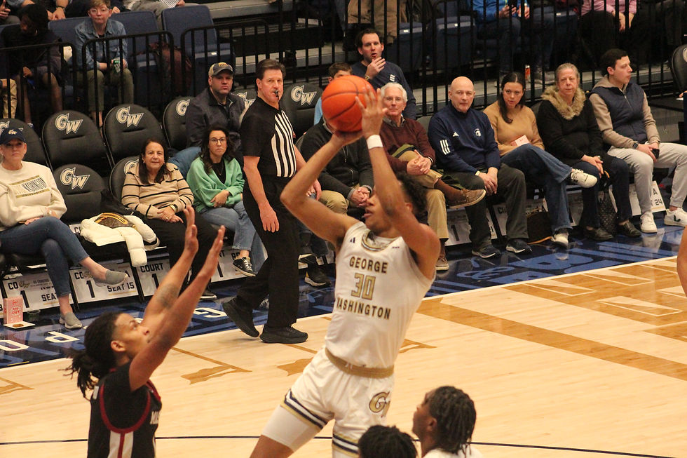 GW center Rafael Castro shoots a turn around jumper during the second half of the Buff and Blue's win over UMass