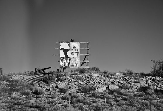 Abandoned sign on road trip by Sam Mackey photography