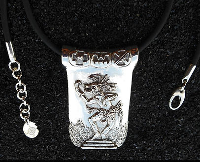 Jaguar Shaman Pendant by Savanna Redman, close up of the glyphs along the top bead.
