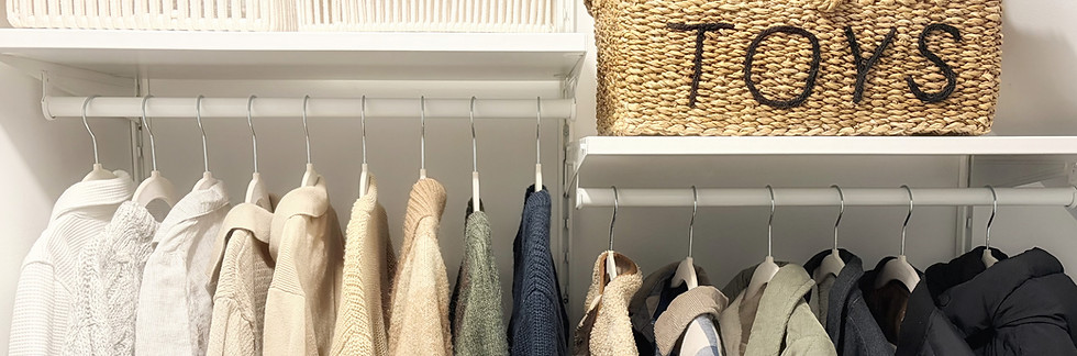organized closet with hanging items and storage toy rattan basket