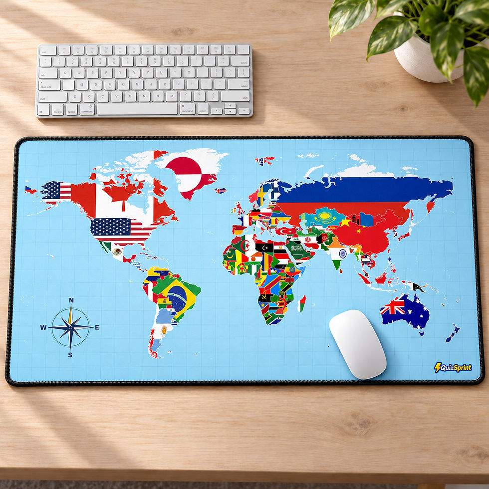 Light blue world map desk mat with country flags and a compass on a wooden desk beside a white keyboard and mouse.