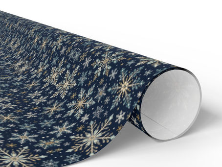 Navy and gold-toned snowflake wrapping paper roll for Christmas gifts