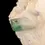 Miniatura: Cabujón de esmeralda mostrando su forma irregular y base plana, ideal para anillo, colgante o pulsera.