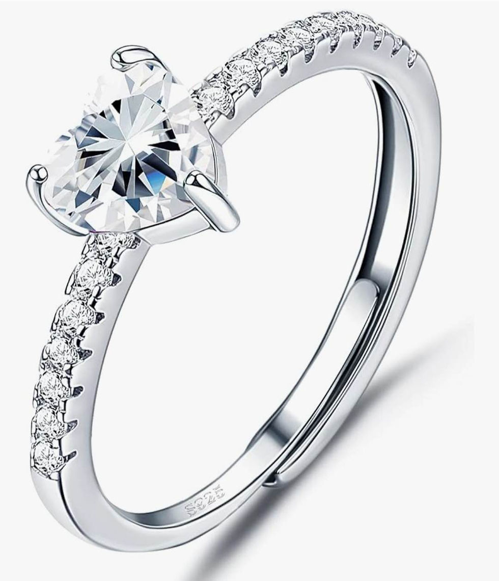 a sterling silver adjustable fit ring with a centre cubic zirconia heart and flowing cubic zirconia on the ring band