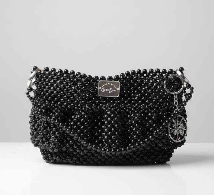 Black beaded fringe bag with a ClawaBear mirror tag and a tree of live keyring