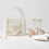 Thumbnail: Ivory Handmade Beaded Bridal Bag On A White Background With Shoes And Jewellery