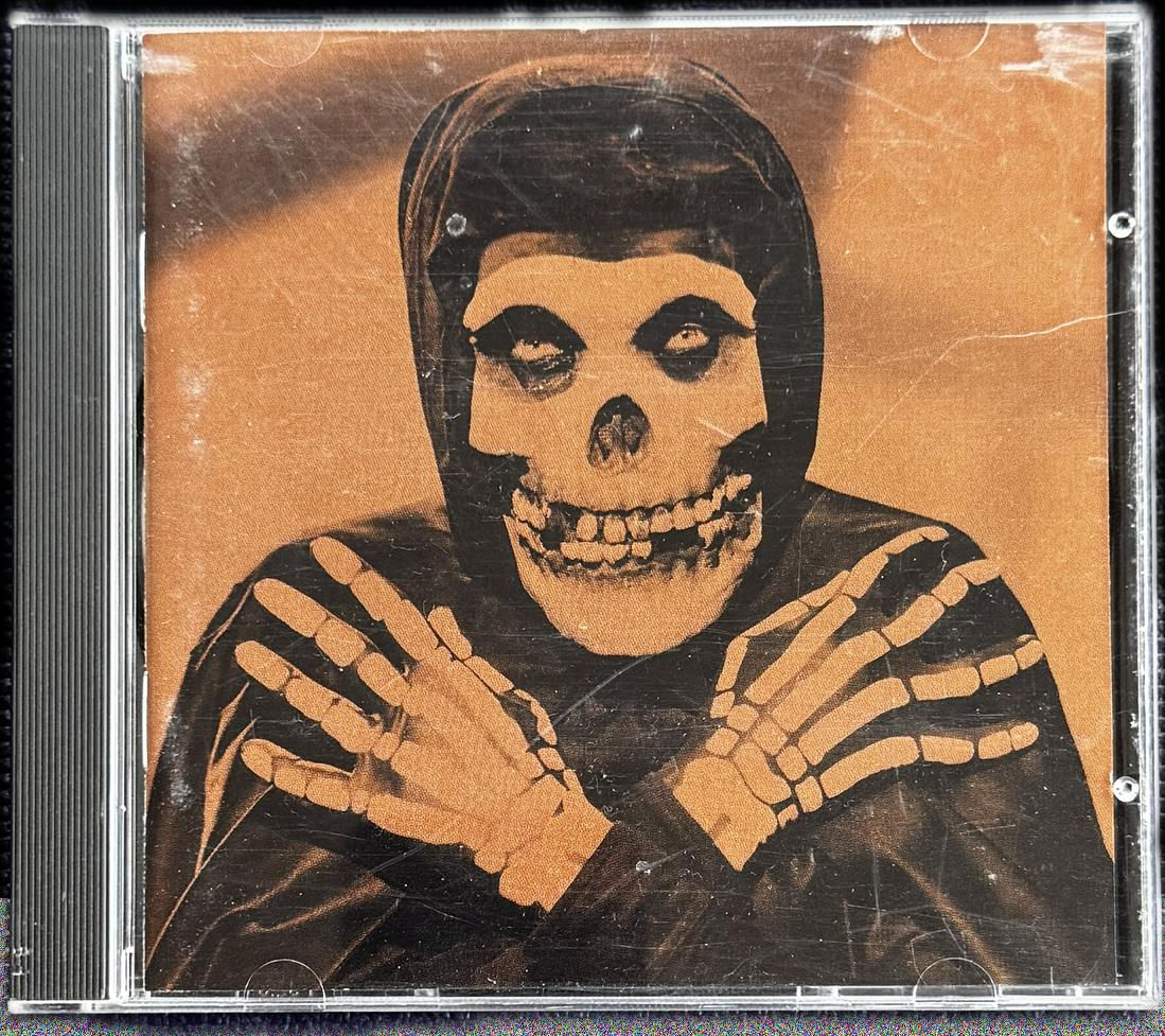 Front cover of The Misfits’ Collection II 1995 US first pressing, featuring the Crimson Ghost artwork in brown and black