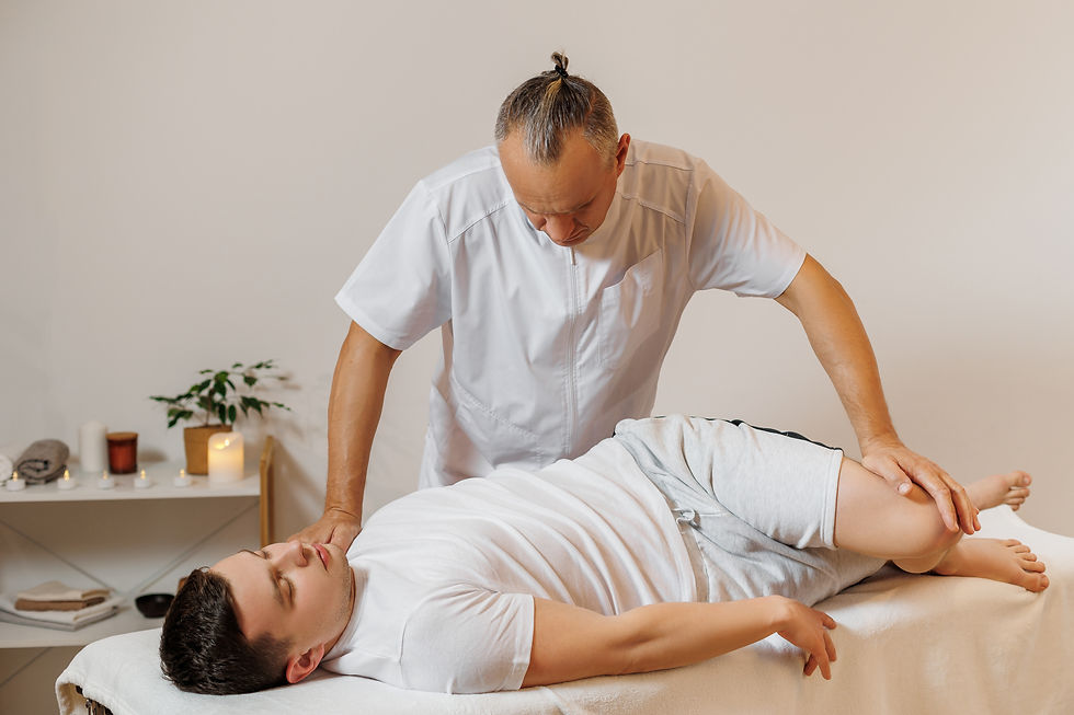 strong-concentrated-masseur-therapist-uniform-making-manual-therapy-sportsman (1).jpg