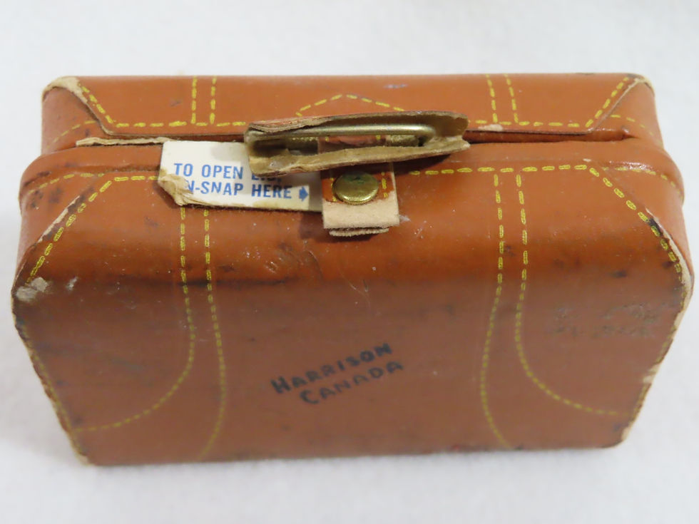 Thumbnail: Top view of vintage doll size leather suitcase sewing kit