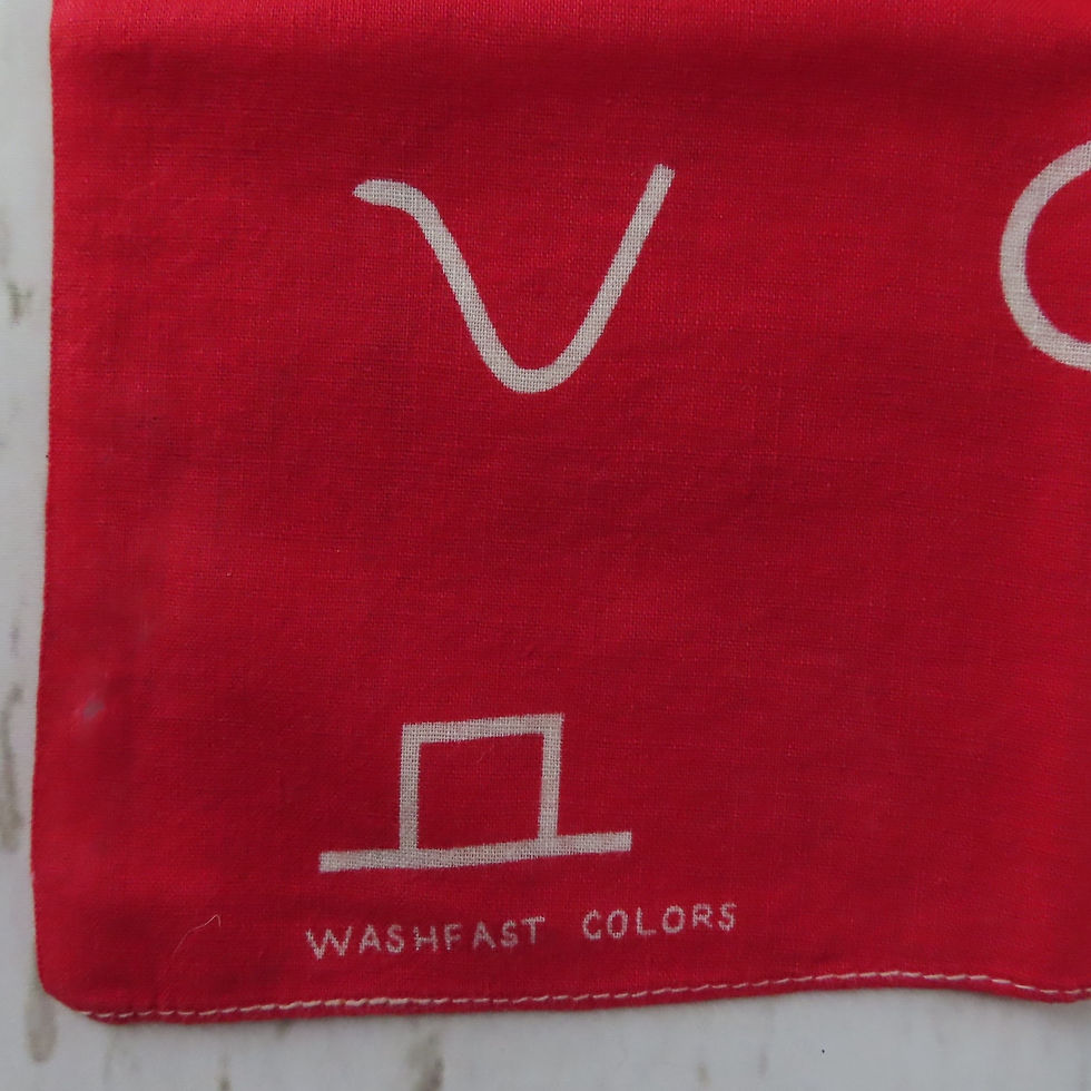 Closeup 'washfast colors' text in corner of red cowboy bandana