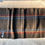 Thumbnail: lengthwise view showing stripes on gray scarf