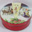 Thumbnail: Closeup lid of 60s Christmas cookie tin with western scenes