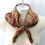 Thumbnail: brown paisley print scarf shown on mannequin