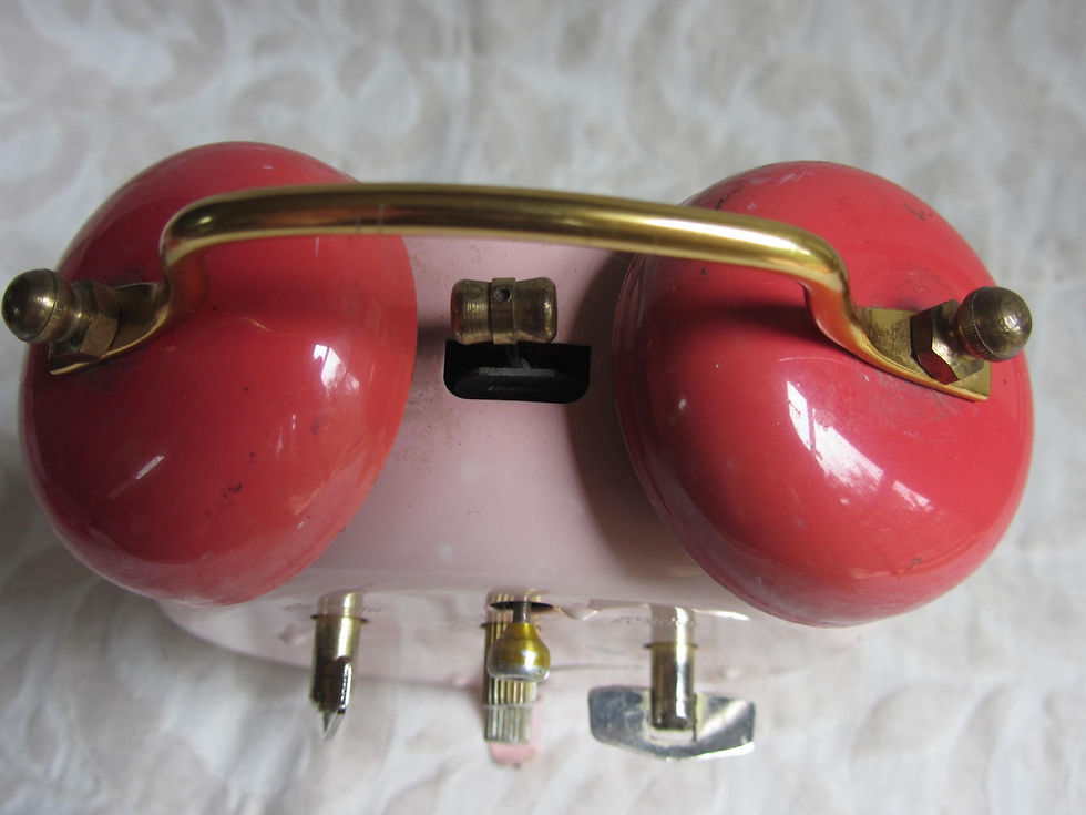 Thumbnail: Red bells or chimes on top of pink Strawberry Shortcake clock