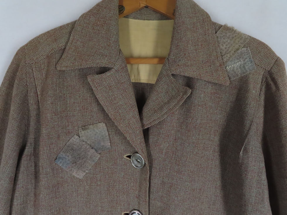Thumbnail: Closeup of patched front of vintage brown wool jacket