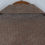 Thumbnail: Closeup discoloration under collar on brown jacket