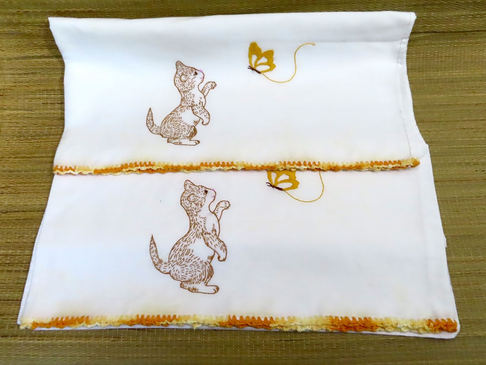 Pair of vintage pillowcases featuring kitty with butterfly embroidery