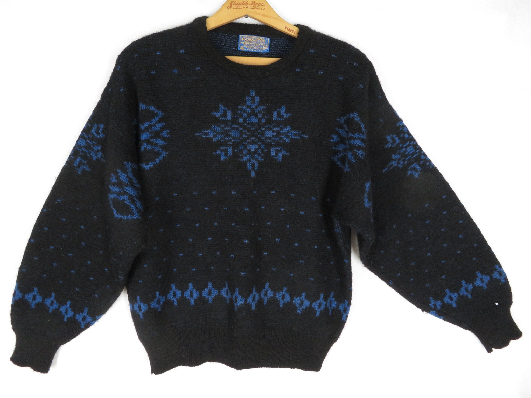 Vintage black wool blue snowflake sweater by Pendleton