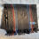 Thumbnail: gray wool scarf with red, tan and blue lengthwise stripes