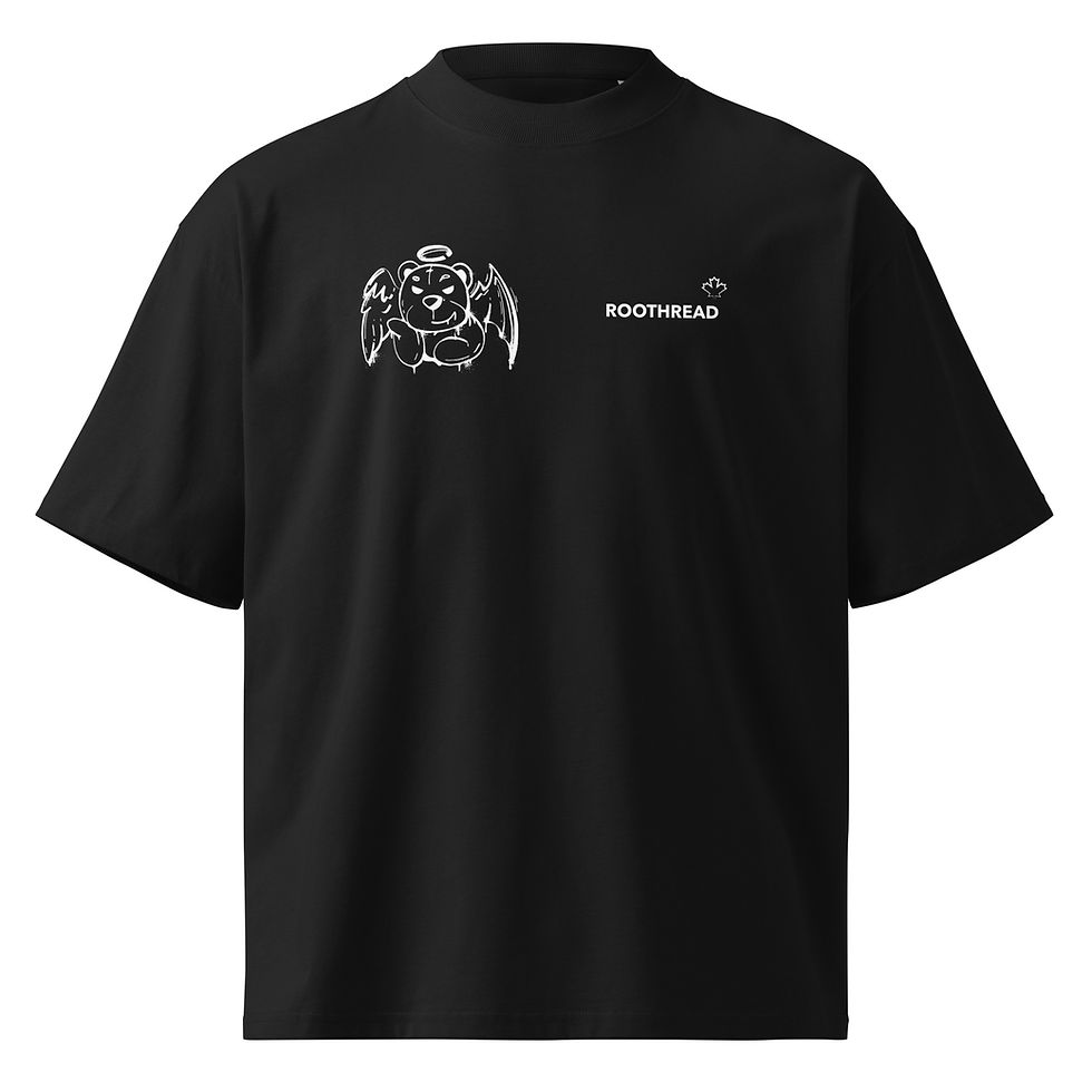 Black oversized organic cotton graphic tee flat lay displaying a white angel demon bear design and Roothread logo.