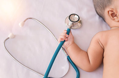 medical instruments stethoscope in hand of newborn baby girl..jpg