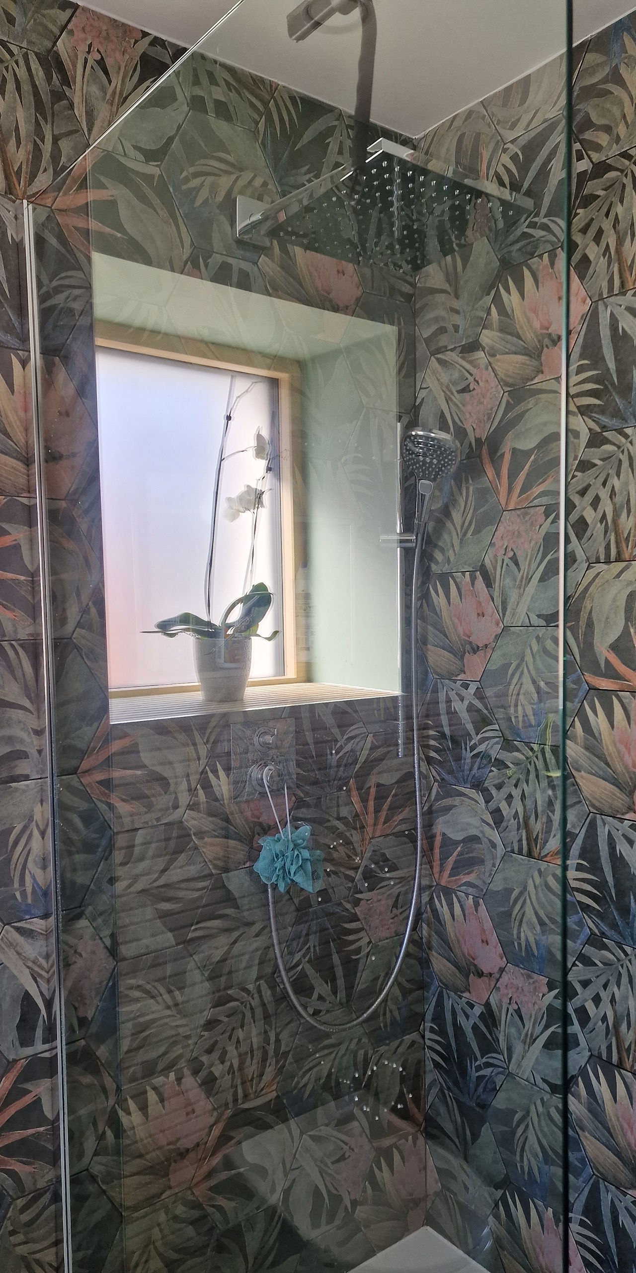 Moisture has cleared on a shower screen in a bathroom