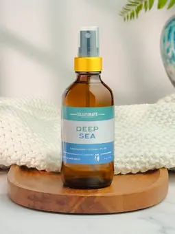 Deep Sea Room & Linen Spray in amber glass jar