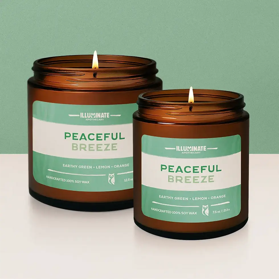 Thumbnail: Two lit Peaceful Breeze soy candle in amber glass
