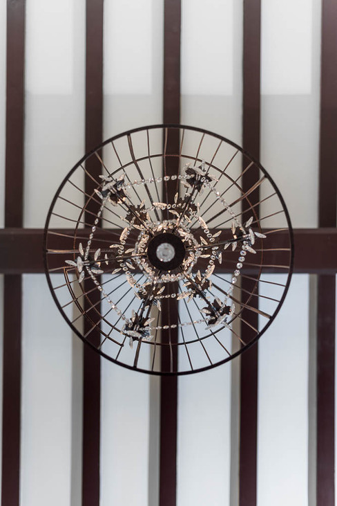 An Interiors chandelier in a Property room captured by a Photographer.
