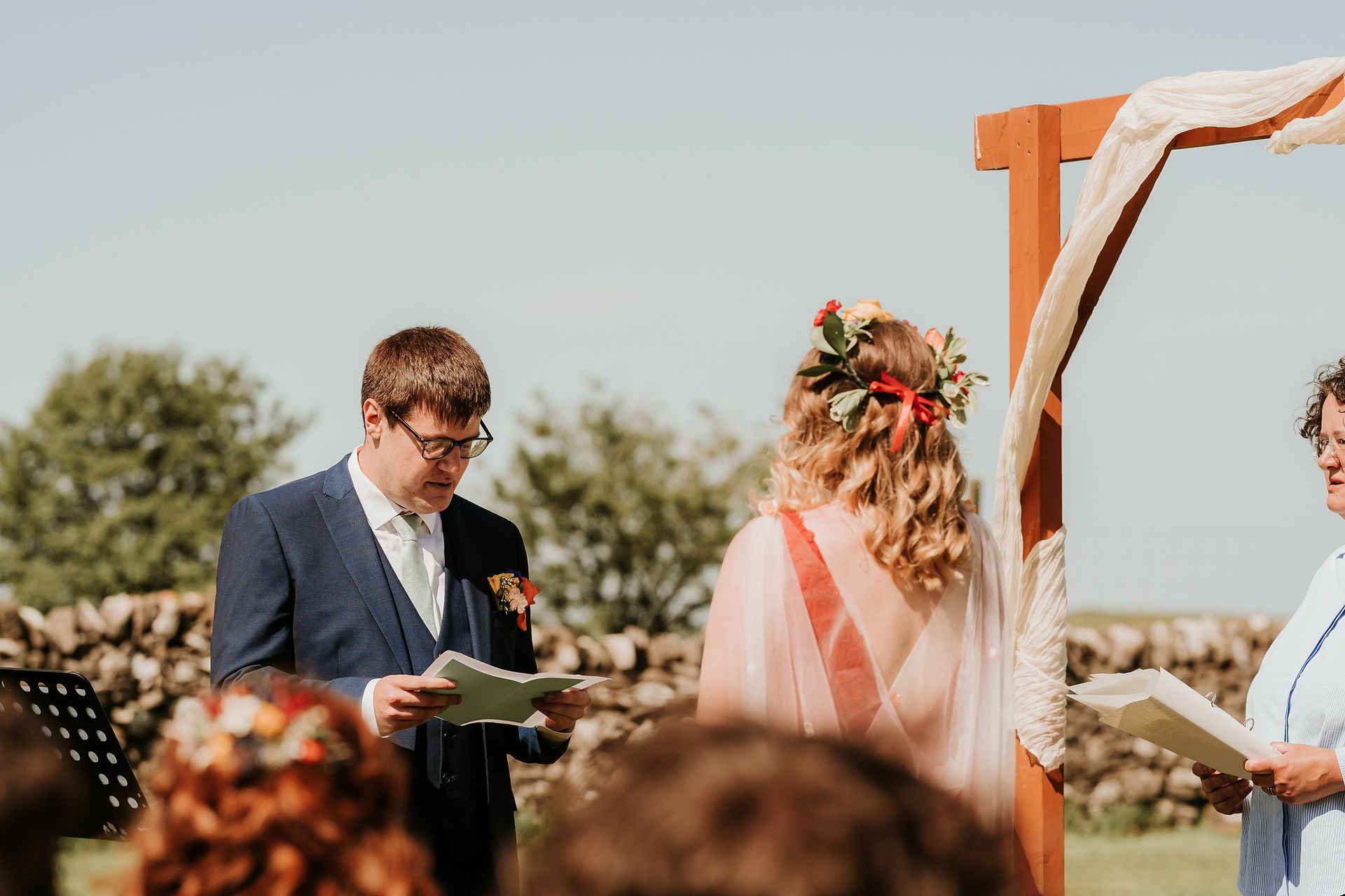 Groom reading his vows during the ceremony