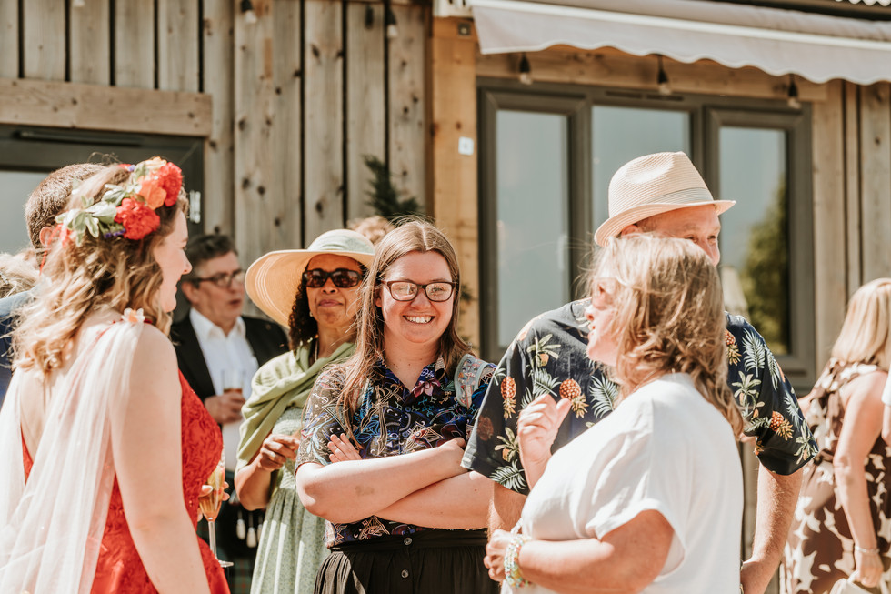 Bride and Groom smiling and interacting with guests