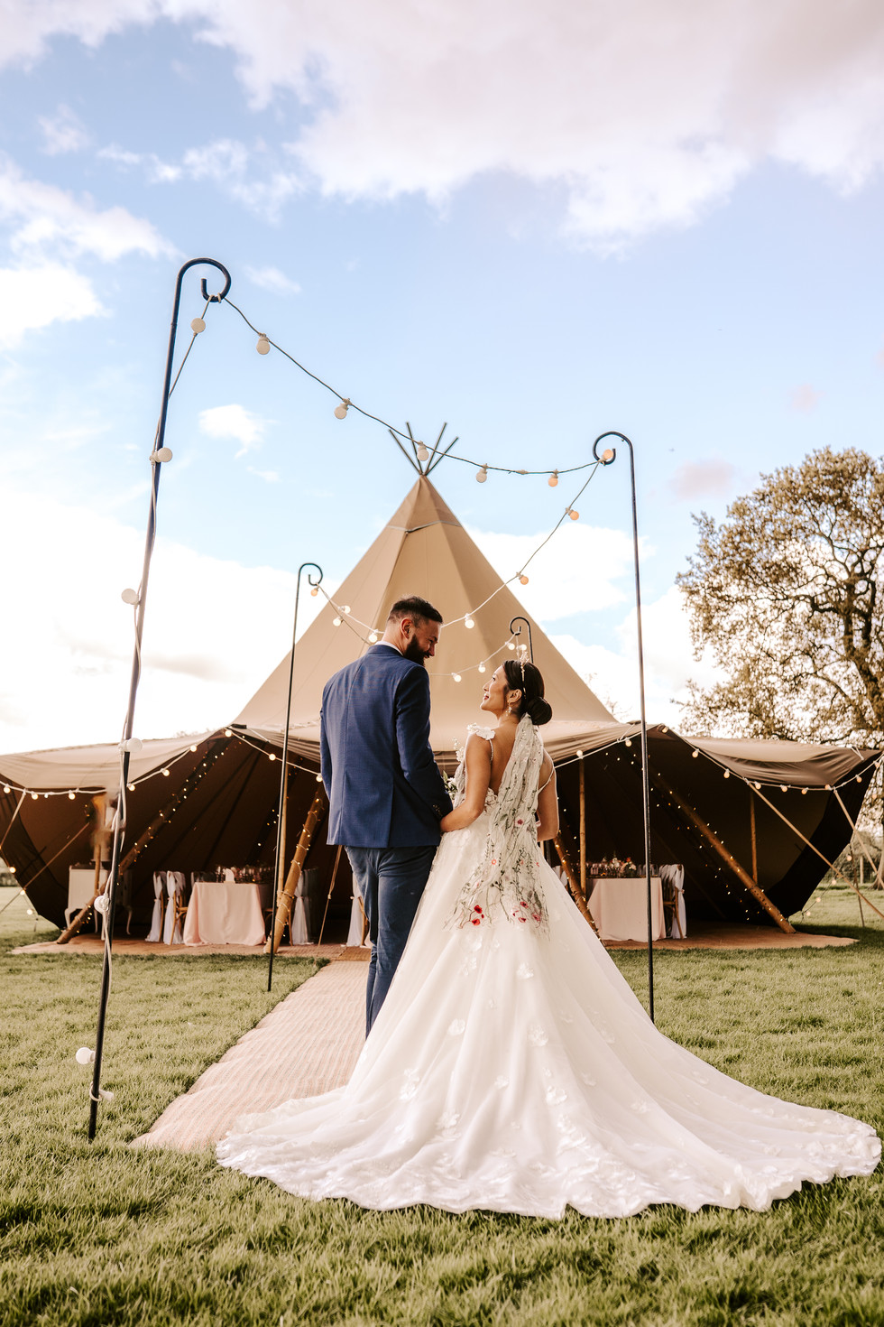 Tipi wedding bride and groom walking towards ceremony