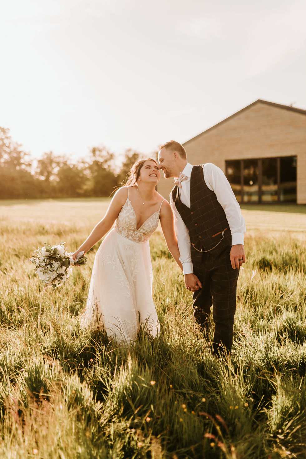 Bride and Groom Formal Portraits in a field at sunset during Golden Hour