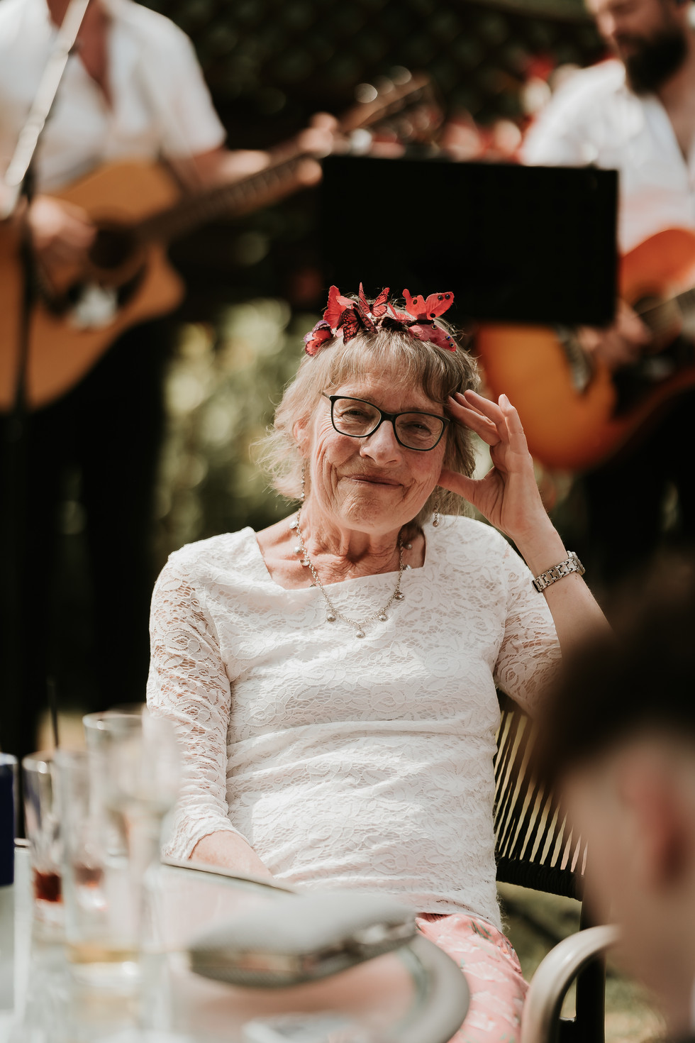 Mother of the Bride sat down, smiling at the camera