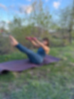 Close-up of a peaceful Pilates instructor guiding a class