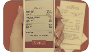 Person using a mobile phone to snap a photo of a business receipt, illustrating how to streamline your expenses tracking with TaxSnaps.