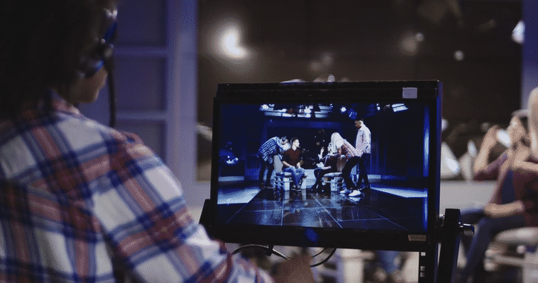 casual-african-american-woman-in-headset-controlling-process-of-shooting-tv-show-st-SBV-32