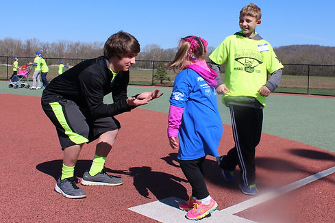 Buddy Helping Player at First Base.jpg