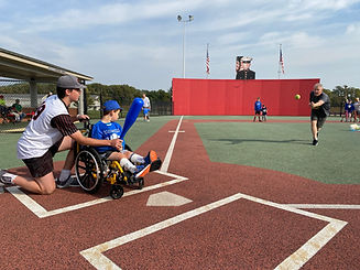 Player - Buddy Kneeling to Help Player Bat with Pitch Release 1.JPEG