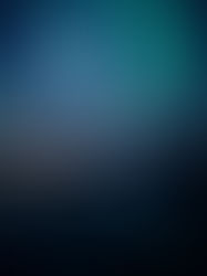 Aurora Borealis at night over a small coastal town.